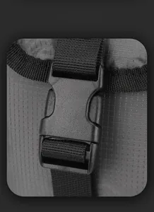 Detail shot of durable buckle and waterproof textured fabric on men's crossbody bag