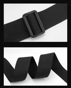 Close-up of durable black nylon strap with matte plastic buckle on crossbody chest bag
