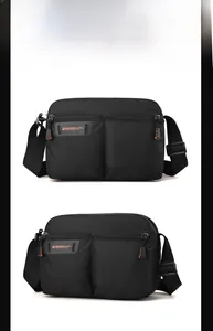 Detail view of water-resistant nylon shoulder bag with adjustable strap and logo