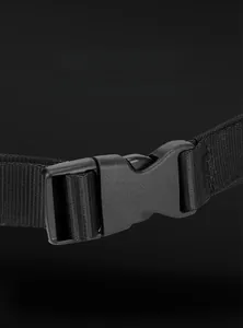 Detail of durable black side-release buckle and nylon strap on a crossbody bag