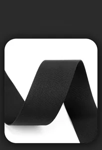Detail of high-density black nylon woven strap with durable texture for casual backpacks
