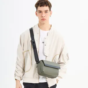 Olive green men's crossbody bag with black tactical strap and matte leather finish