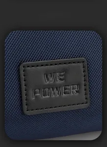 Detail of durable blue nylon fabric and embossed brand logo on the trendy chest bag
