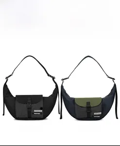 Detailed comparison of black and navy nylon crescent bags with adjustable straps