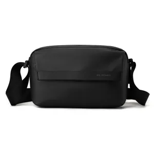 Minimalist black square crossbody bag for men in textured nylon with adjustable strap