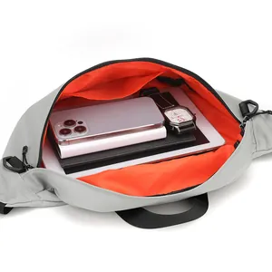 Light gray crossbody bag with orange lining and large capacity for tablet and phone