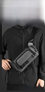 Detail of dark grey multi-layer crossbody chest bag showing high capacity storage