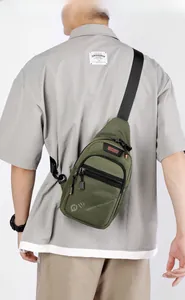 Olive green nylon chest bag detail with orange zipper pulls and casual strap style