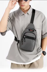 Detail view of grey waterproof Oxford chest bag for men with WEPOWER logo and zipper