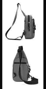 Detail view of grey crossbody bag showing multiple zippers and adjustable strap side profile