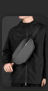 Detail view of the waterproof matte grey sling bag with adjustable nylon straps