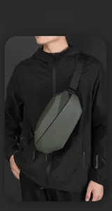Detail of dark green tactical chest bag with geometric design and waterproof texture