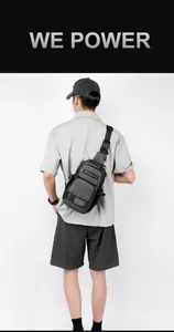Detail of durable grey oxford fabric chest bag with orange stitching and wide strap