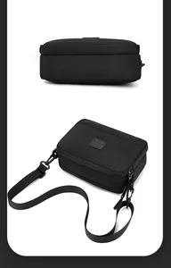 Détail du sac de sport en nylon imperméable avec double fermeture éclair et logo patch