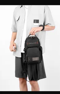 Front detail of black multifunctional tactical chest bag with multiple zipper compartments