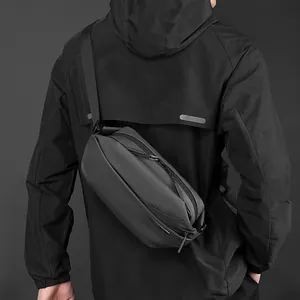 Minimalist black waterproof crossbody chest bag for men with adjustable strap in matte finish