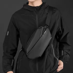 Minimalist black geometric chest bag for men with waterproof matte finish on a model