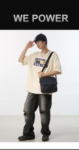 Detail view of durable nylon messenger bag with secure buckle closure and adjustable strap