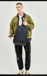 Close-up of a large-capacity navy blue backpack with adjustable buckles and mesh pockets