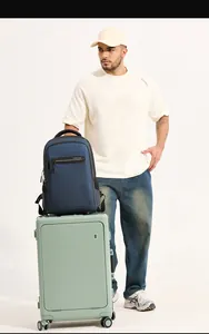 Detail of dark blue business laptop backpack with front zipper pocket on a suitcase