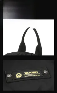 Detail des schwarzen Nylongriffs und des WE POWER Stickereiaufnähers mit Nieten