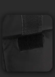 Close-up of durable black nylon fabric with velcro strap and strong stitching details