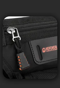 Macro view of black nylon bag with metal zipper and orange rubber pull tab detail