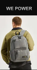 Close-up of waterproof nylon texture and multi-pocket design on casual grey backpack