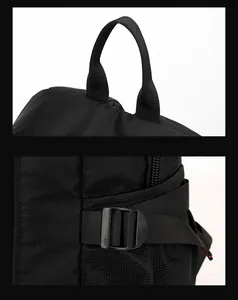 Detail of durable top handle, side adjustable straps and mesh pocket on black backpack