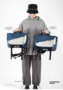 Size comparison between standard and large navy grey messenger bags on a male model