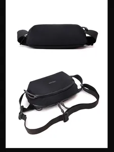 Detail of durable black nylon crossbody bag with dual zippers and adjustable strap