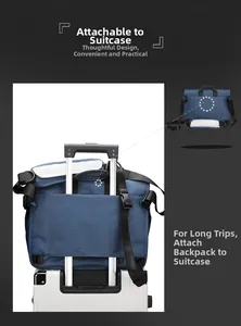 Detail of blue nylon crossbody bag with luggage strap fixed on suitcase handle
