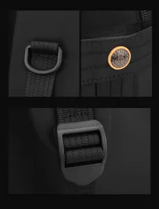 Detail view of durable black nylon backpack with decorative metal button and D-ring