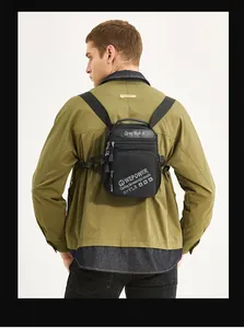Close-up back view of a WEPOWER black convertible chest bag on a male model's back