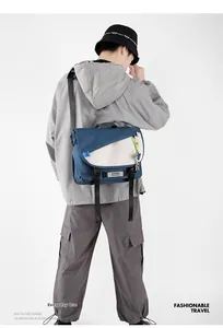 Detail view of navy blue and off-white crossbody bag with buckle and neon cord decoration