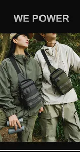 Detail of urban outdoor tactical crossbody bag with multiple zipper compartments and straps