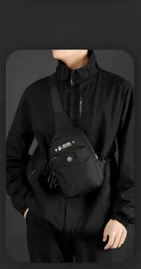 Detail of waterproof nylon crossbody chest bag showing texture and adjustable strap