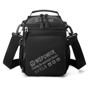 Black tactical crossbody bag with adjustable strap and multi-zipper compartments
