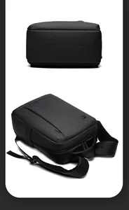 Detail of the black business laptop backpack showing the thick handle and padded straps