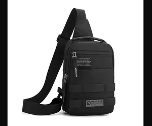 Close-up of a black tactical crossbody bag with reinforced webbing and zipper details