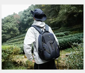 Outdoor waterproof hiking backpack for men shown in forest setting with trekking poles