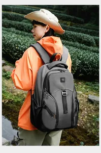 Detail of multi-pocket hiking backpack with padded straps shown in outdoor setting