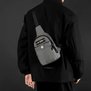 Versatile grey crossbody chest bag for men made of durable fabric with black adjustable strap