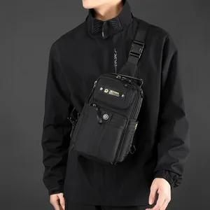 Outdoor commute chest bag in black nylon with adjustable shoulder strap on male model