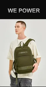 Detailed view of an army green durable nylon backpack worn by a model in a studio