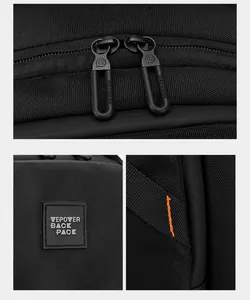 Detail view of durable black backpack with orange stitching and branded metal zippers