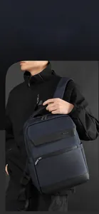 Detail of water-resistant navy nylon business backpack with premium black leather accents