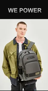 Detailed view of heavy-duty zippers and reinforced buckles on a charcoal grey travel backpack