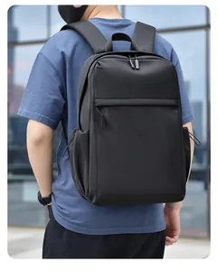 Close-up of a minimalist black backpack with water-resistant fabric and hidden zipper pocket