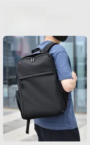 Detail view of a black business commuter backpack with waterproof fabric and side pockets